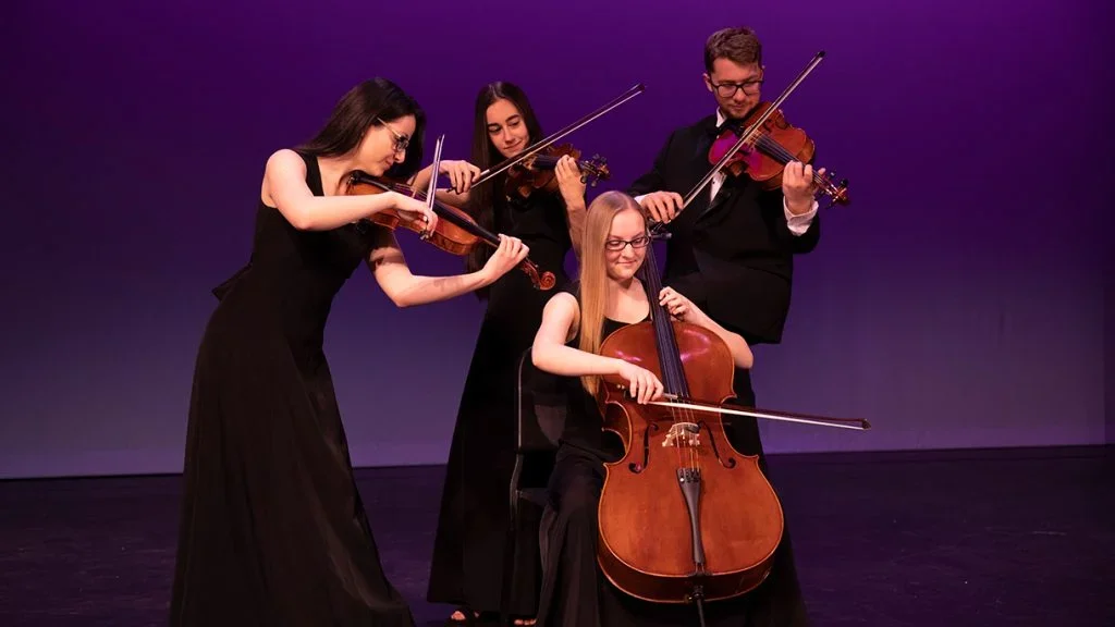 Musicians performing together; photograph retained from the original Arts Marketing Group website
